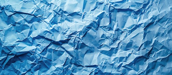 Wall Mural - Blue crumpled paper background with copy space image for design