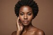 © ThomasLENNE - Face, beauty and skincare with a model black woman in studio on a brown background for natural hair care. Eyes, portrait and makeup with an attractive young female posing to promote cosmetics