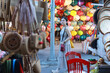 © LT - girl take a walk between the lantern light stall in the night market of Hoi An old town, vietnam