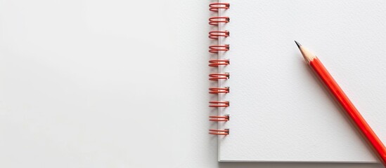 Poster - Notebook and pencil on a white backdrop with copy space image available