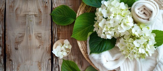 Poster - Spa themed arrangement with hydrangea blossoms on a wooden backdrop offering a serene copy space image