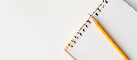 Poster - Notebook and pencil on a white backdrop with copy space image available