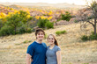 © Allison - Couple enjoys a beautiful day in the countryside surrounded by nature and vibrant landscapes during golden hour