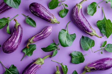 Wall Mural - Fresh Eggplants and Leaves on a Purple Background   Vibrant Food