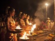 © AI_Imaginator - Indian women perform a traditional ceremony with fire and incense.