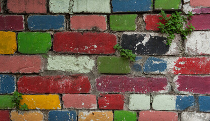 Old ancient wall with colorful bricks