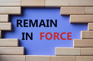 Remain in Force symbol. Concept words Remain in Force on wooden blocks. Beautiful purple background. Business and Remain in Force concept. Copy space