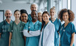 © los_ojos_pardos - photo of a group of multicultural doctors and nurses standing and smiling while working at a hospital, wearing scrubs,  full view