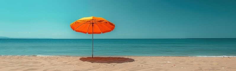 Orange umbrella on the beach near the ocean, Travel concept