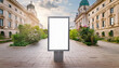 © Hulinska Yevheniia - Blank white vertical advertising banner billboard stand on the sidewalk Mockup street background.