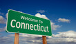 © Andy Dean - Welcome To Connecticut Green Road Sign Over Blue Sky with Some Clouds.