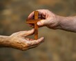 © Daria - Christian man passing wooden cross to woman s hands  symbolizing great commission concept