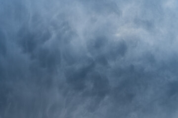 Wall Mural - dark grey stormy sky mammatus clouds texture abstract background.