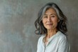 © senyumanmu - middle aged Asian woman dressed casually