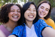 © Wavebreak Media - Smiling friends taking selfie together outdoors, enjoying time and bonding