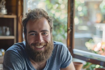 Wall Mural - Smiling bearded young male model dressed casually