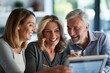 © kitipol - Middle-aged couple smiling and nodding as their financial planner explains various retirement options using a tablet.