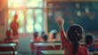 © suphamit - Photos of education and school concepts Focus on American schoolchild studying in class, raising right hand, blurred teacher, blackboard in front of class teacher participation