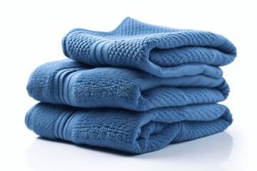 Folded blue towels isolated on white background, close up