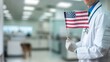 © Abubakar - Honoring Labor Day with a veterinarian holding an American flag, in front of a blurred animal clinic background.