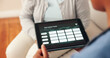 © peopleimages.com - Nurse, senior person and tablet screen in nursing home for daily schedule. dementia patient and elderly care. Female people, tech and reminder for activity, support or help for memory on wellness app