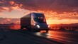 A sleek, modern electric semi-truck travels on a desert highway at sunset, with a dramatic sky and mountains in the background.