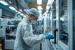 © JackBoiler - In a modern manufacturing facility, a technician in a protective uniform inspects a freshly produced plastic component for quality control.