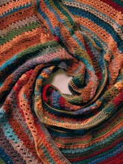 Sticker - A close up of a crocheted blanket with many colors, AI