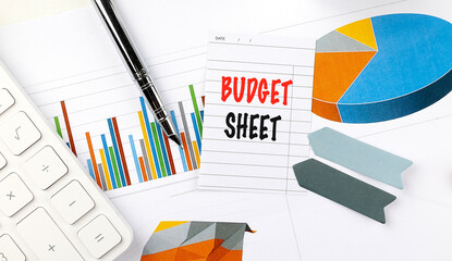 Poster - BUDGET SHEET text on note paper on chart background