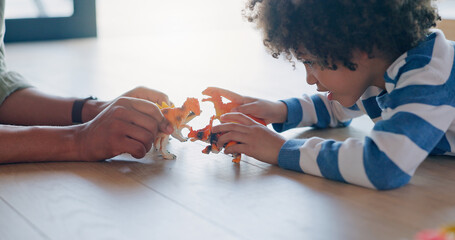 Wall Mural - Bonding, son and parent with toys, floor and playing in lounge, games and fun for kid in family home. Boy, hands and break in weekend for father and together with child, ground and living room