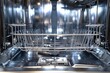 © Lubos Chlubny - Shiny dishwasher interior with clean, empty dish racks and cutlery trays