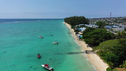 Wall Mural - Beautiful Mauritius island with beach Flic en flac. Coral reef around tropical palm beach, Flic en Flac, Mauritius. Aerial view of a beautiful beach along the coast in Flic en Flac, Mauritius.