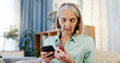 © peopleimages.com - Home, pills and elderly woman with phone for healthcare information, advice and research on medicine. Retirement, telehealth and senior person with container for reading label, dosage or side effects