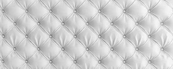 Close up of white tufted upholstery with buttons