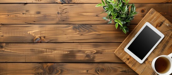 Wall Mural - desk with tablet mockup viewed from above with empty space for customization; copy space image.