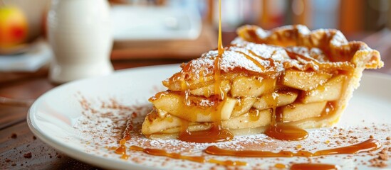 Poster - Closeup copy space image of a slice of apple pie drizzled with caramel sauce and sprinkled with cinnamon.