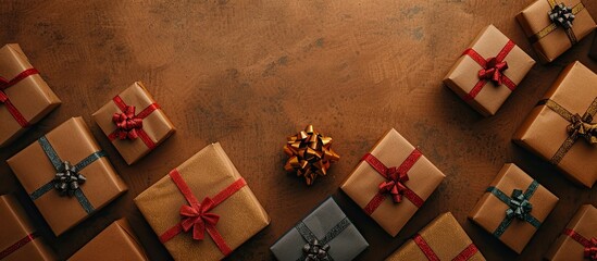 Poster - Elegant Christmas gift box displays arranged on a background of rustic brown paper providing ample copy space image.
