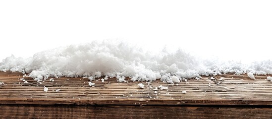 Poster - Christmas season setting with a pile of snow on a wooden surface against a white backdrop, creating a festive copy space image.