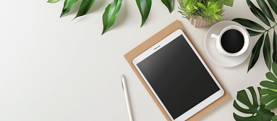 Wall Mural - desk with tablet mockup viewed from above with empty space for customization; copy space image.