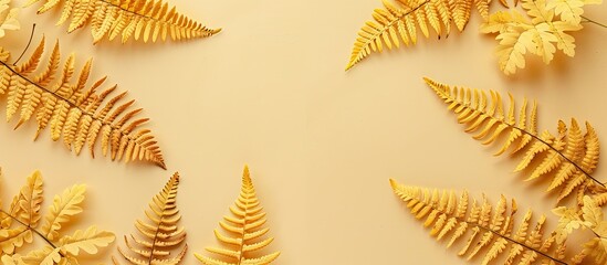Poster - Beige background adorned with top-view yellow autumn fern leaves, creating a flatlay composition with ample copy space image.