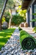 © Karn AS Images - Close-up of rolled synthetic turf, landscaped garden setting, home exterior,