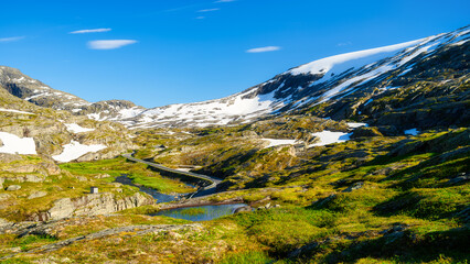 Wall Mural - nature in norway. panoramic view of wild norway. road among the rocks and mountains. bright sunshine