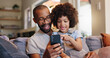 © WesSide/peopleimages.com - Phone, dad or kid in black family or home for bonding or streaming online for movie, web or video. Technology, download or single parent father with boy, child or touchscreen for learning development