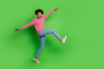 Sticker - Full length photo of handsome good mood guy wear pink sweater dancing emtpy space isolated green color background