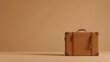 © Aleksandra Ermilova - Classic vintage suitcase on minimalist brown background. Copy space