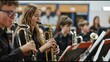 © ColdFire - Young musicians playing saxophones in a school band