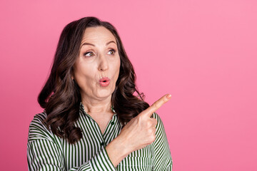 Sticker - Photo of nice aged lady look direct finger empty space wear striped shirt isolated on pink color background