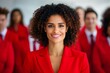 © Maryann - group of people standing in office, confident black woman wearing red leading corporate team with confidence