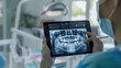 © redflower - Doctor Showing Dental X-ray on Tablet in Dental Clinic