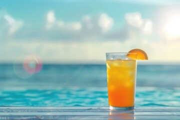 Wall Mural - Refreshing summer drink with beach backdrop.